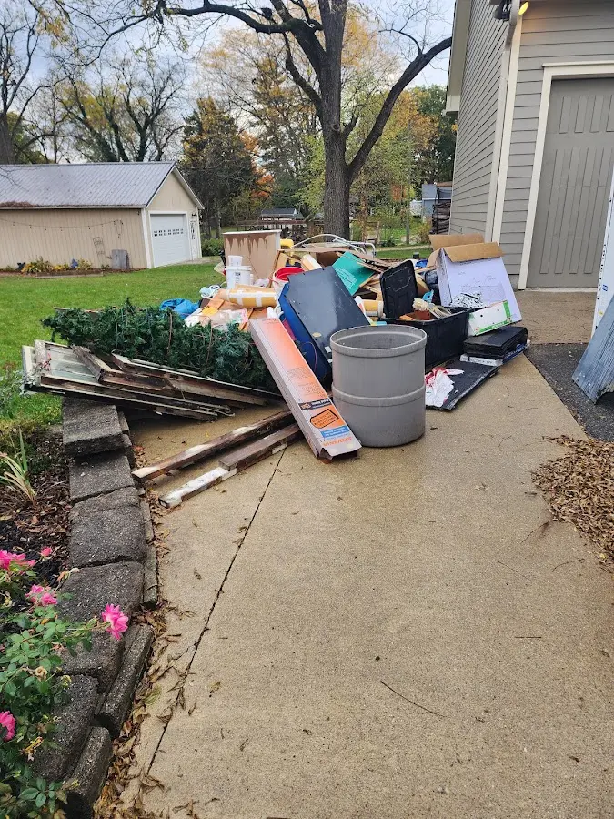 Dumpster being loaded with debris for Residential Dumpster Rental in Dundalk